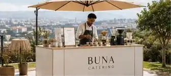 BUNA bar under an umbrella overlooking the city